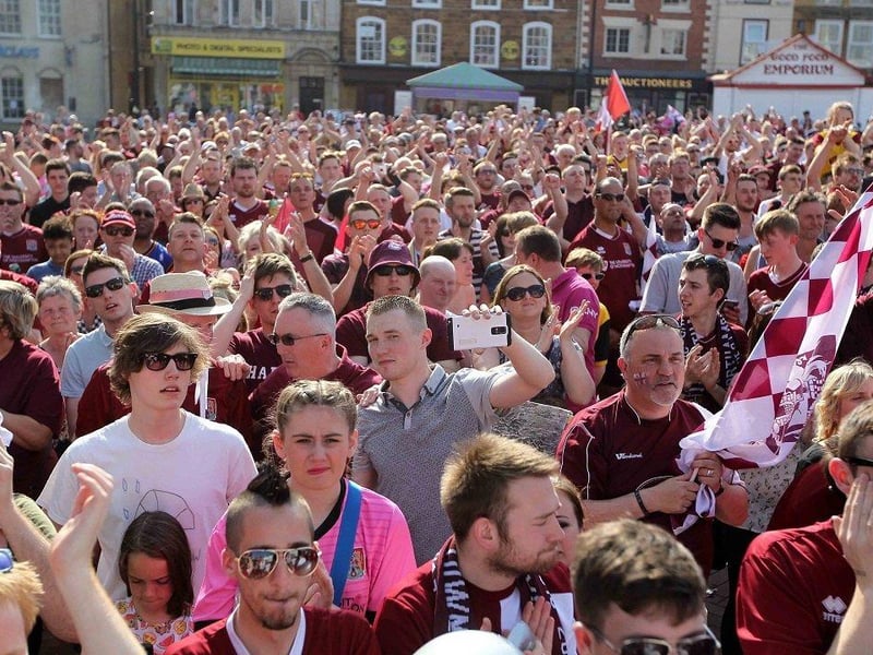 The Northampton Town Football Club open top bus victory parade in Market Square in 2020.