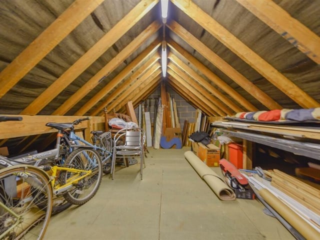 The attic has been converted into a roomy storage space to suit any needs