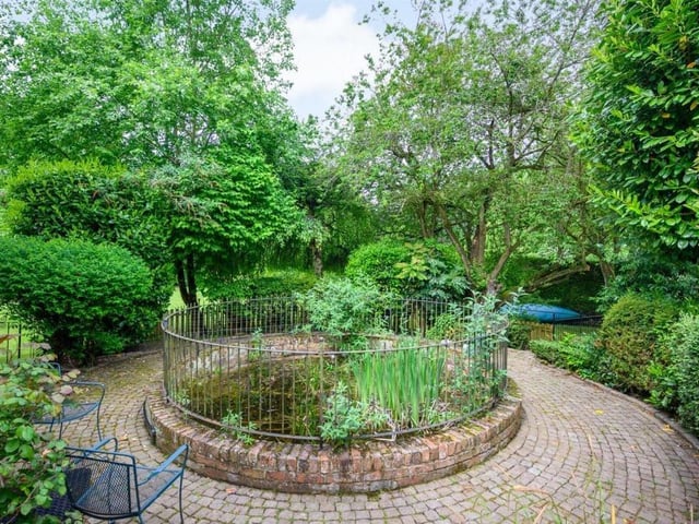 This Victorian home has a tennis court, huge gardens and a private mooring on the River Nene.