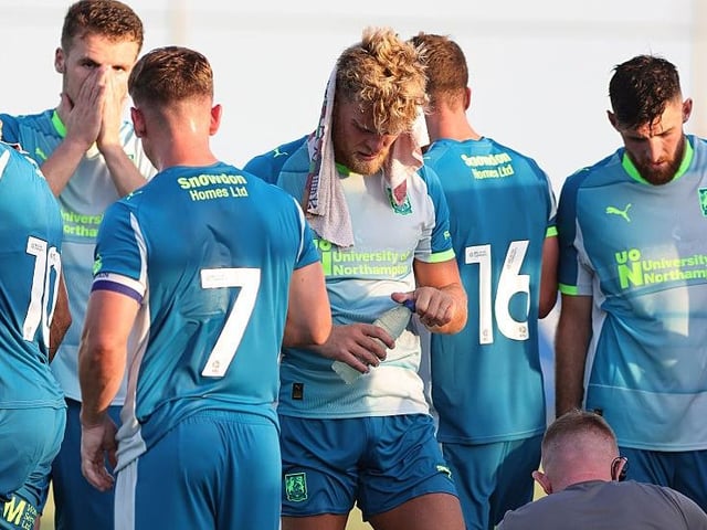 The players take a much-needed water break in the 33 degrees temperatures