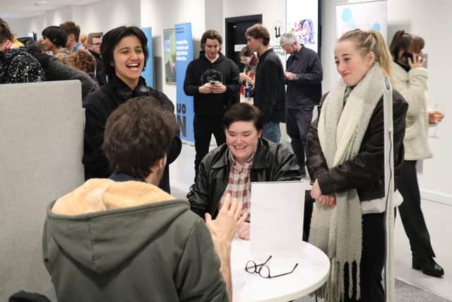 Students network with industry professionals.
