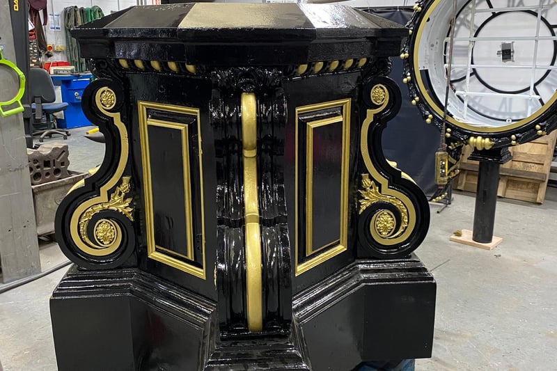 Applying a top coat of black gloss paint to all of the decorative metalwork, to the pillar, clock drum and the base.