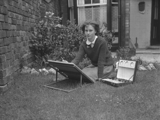 May 25, 1962 - Joy Brawn painting on lawn
