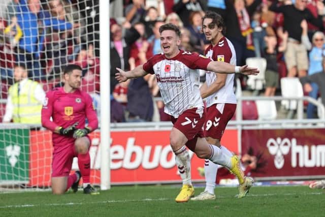 Sam Hoskins runs away to celebrate goal number 12 for the season against Newport County on Saturday (Picture: Pete Norton)