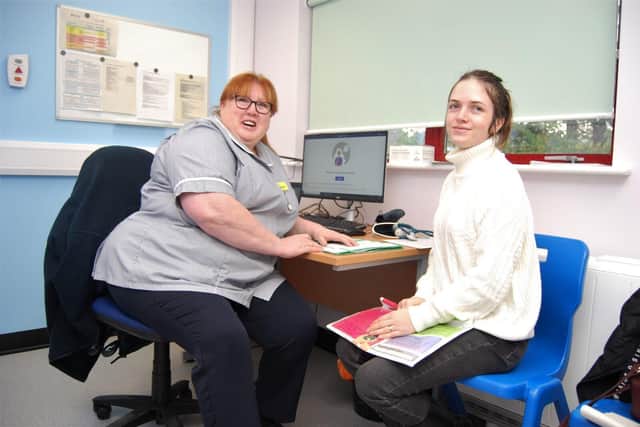 Ioana Trofin has a consultation with community midwife Sharon Waples