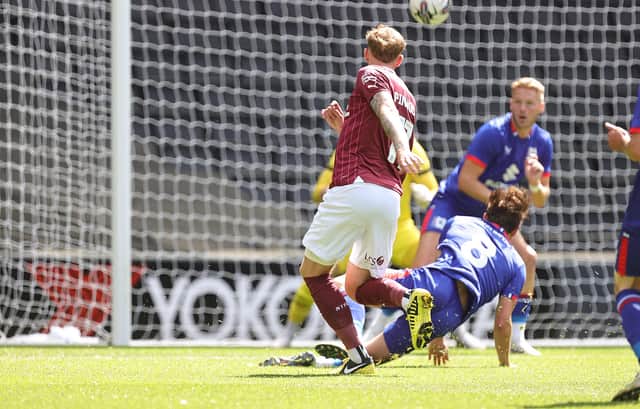 Mitch Pinnock fires in the opener for the Cobblers against MK Dons on Saturday. Picture: Pete Norton / Getty