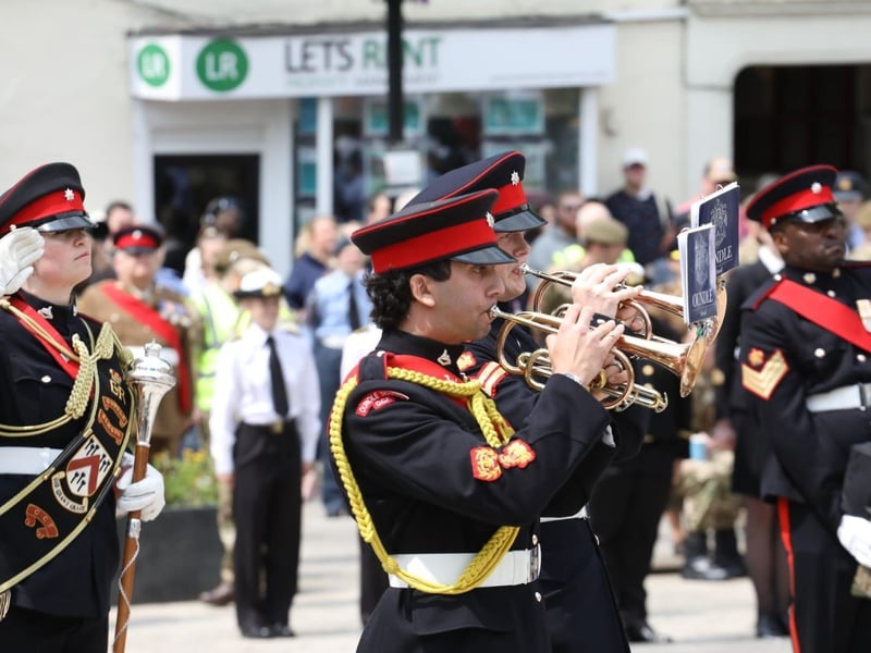 Kettering town centre: crowds line town centre to welcome The Royal Anglian Regiment for Armed Forces Day parade /National World