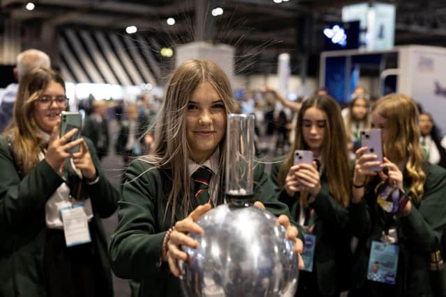 A student gets a hair raising experience discovering static energy at the Big Bang Fair