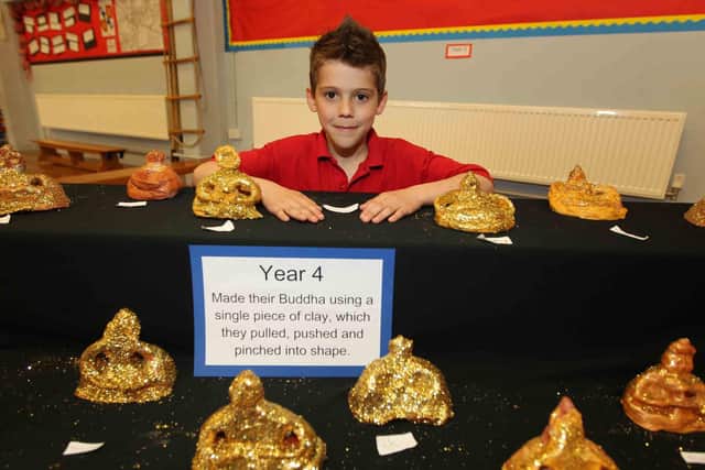 2011: A community event for parents and children at Earl Spencer Primary School.  Pictured: Ellis Willix, 8, with a buddha he made.