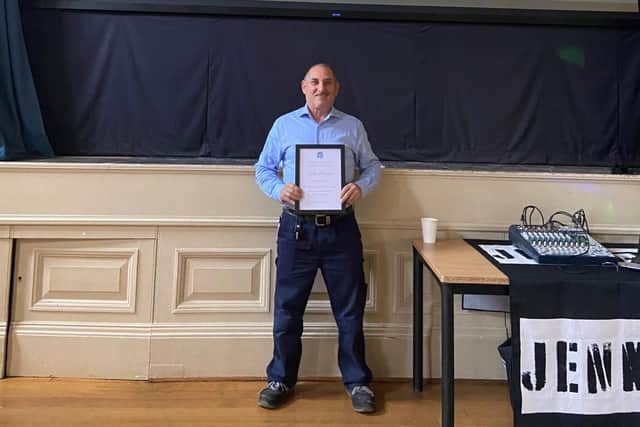 Stefano picking up his Long Service award