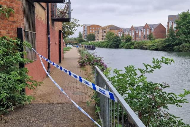 The cordon at the River Nene behind Auctioneers Court was lifted on Tuesday August 6 evening. Photo: Logan MacLeod