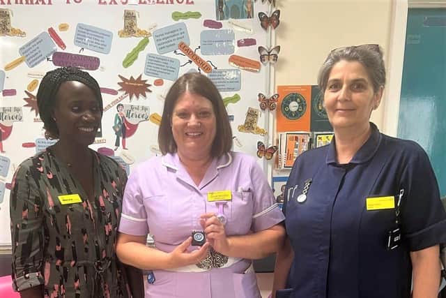 Sarah Woolley with her award and Director of Nursing Nerea Odongo and Matron Elena Stroia