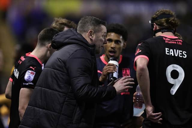 Kevin Nolan talks tactics with his players