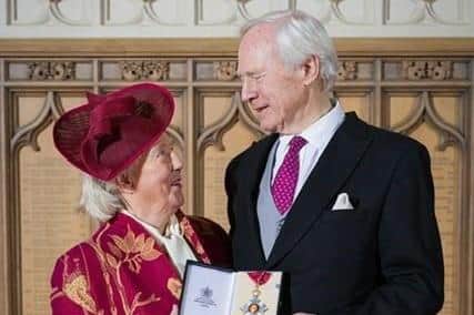 David Laing accepting his CBE in January 2024, alongside his wife Mary