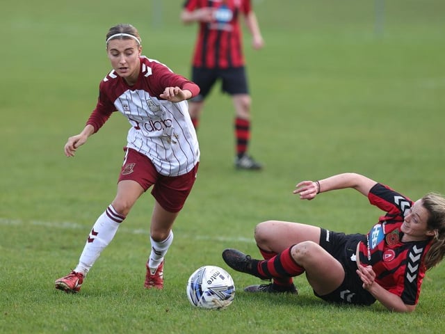 Gracie Williams goes past Dronfield's Eleanor Rose
