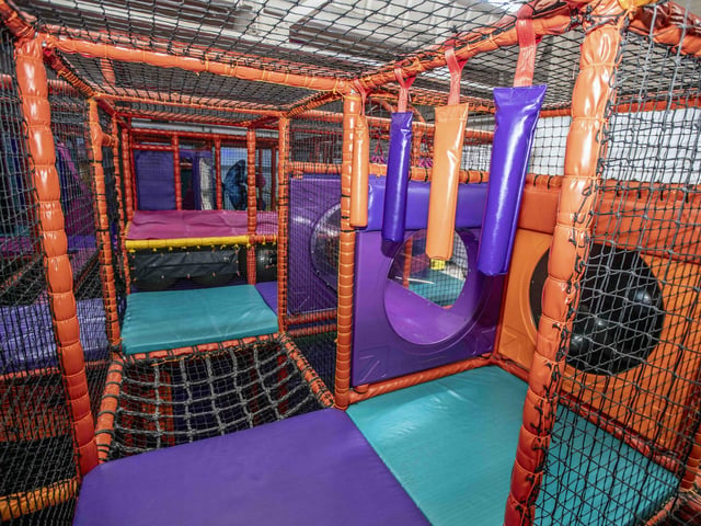 There is a new sensory room, car wash role play zone, two large ball pits with ball showers, and a sports court with astroturf on the top level.