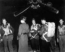 Jedurgh Teams waiting to Board a B24 note that the parashutist ar all wearing military uniform
