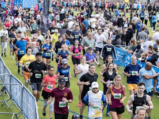 Hundreds of runners braved showers and wind to take on the race on Sunday (May 25), which started and finished at Sixfields stadium.