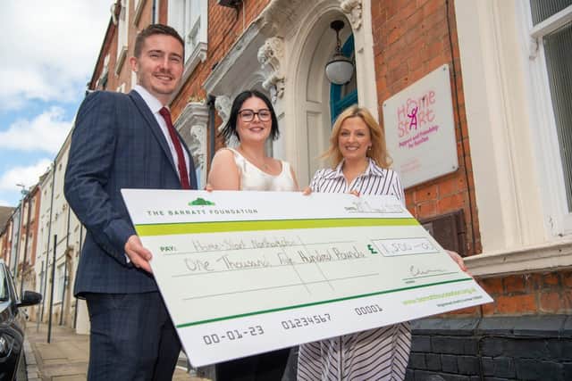 Matt and Mollie from Barratt Homes with Zoe Reynolds outside Home-Start Northampton
