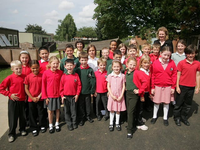 Sally Gedney, head, Judith Thompson, deputy head and children from the School Council at Parklands Primary School celebrating their good Ofsted report.