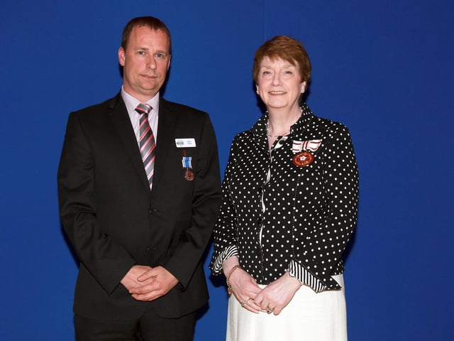 2013 - Northamptonshire Police Long Service awards ceremony takes place at their Headquarters, Wootton Hall, Northampton. Det Sgt Matt Davis, presented by Deirdre Newham.