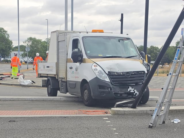 A WNC crashed into the traffic lights on University Drive