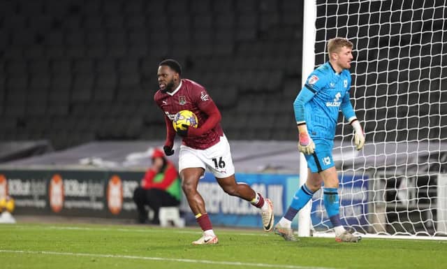 Tyreece Simpson grabs the ball after levelling from the penalty spot, only for MK Dons to go and score the winner two minutes later.