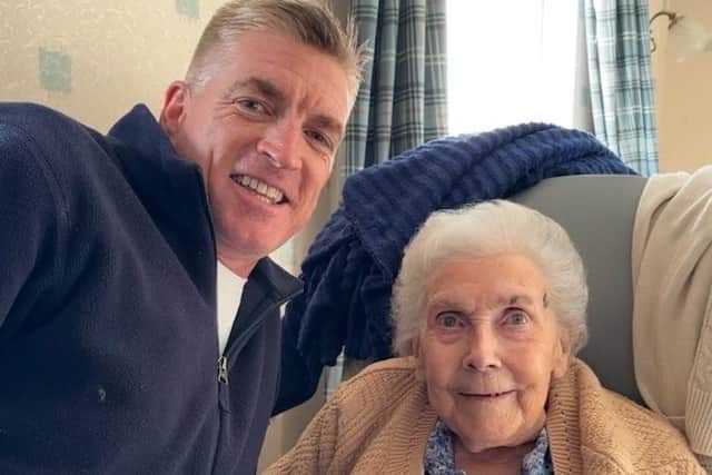 Vera and her grandson Simon, who flew over from his home in Australia to surprise his grandmother for her 100th birthday.