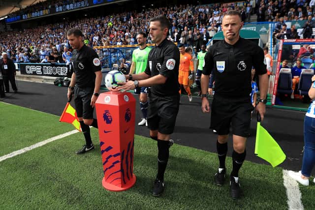 Stuart Burt regularly works alongside referee Michael Oliver
