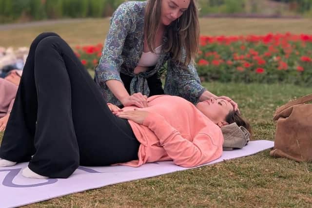 Wildflower Ali Mitchel guiding a client’s breath-work
