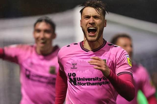Sam Sherring celebrates after scoring his first Cobblers goal and making it 3-0 against Bradford.