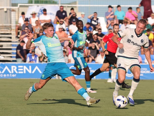 Jack Perkins pokes the ball away from Casper De Norre