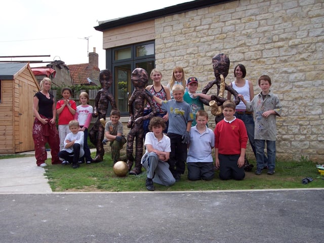 Yardley Hastings Primary School pupils in year five with trainnee teachers from the University of Northampton showing off their new life size sculptures.