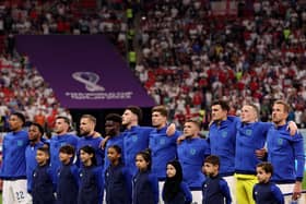 AL KHOR, QATAR - NOVEMBER 25: England stands for their national anthem before the match against the United States during the FIFA World Cup Qatar 2022 Group B match between England and USA at Al Bayt Stadium on November 25, 2022 in Al Khor, Qatar. (Photo by Elsa/Getty Images)