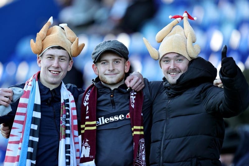 Northampton Town fans with festive head wear during the Sky Bet League Two between Mansfield Town and Northampton Town at One Call Stadium on December 26, 2022.