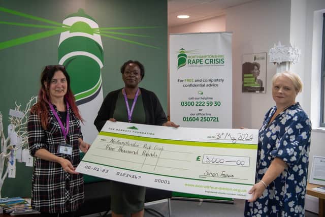 BN - SGB-43185 - Kate from Barratt Homes presenting Northamptonshire Rape Crisis with their cheque