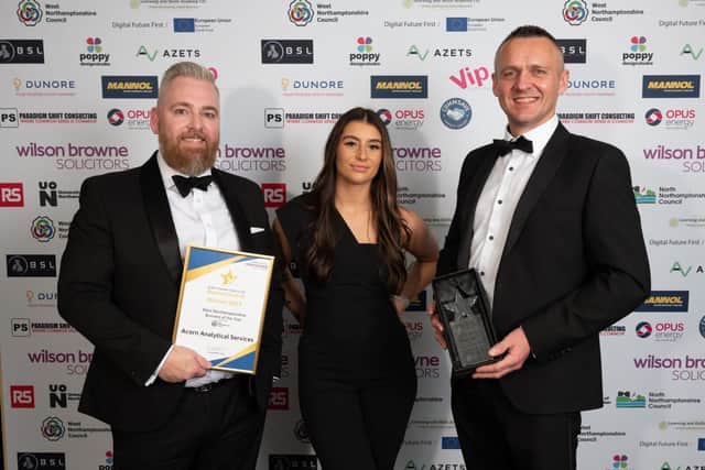 Ian Stone, left, Neil Munro and Jody Thomas celebrate Acorn's success