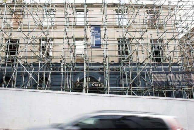 The former Fat Cats bar burned down in 2012 and has had scaffolding around it ever since