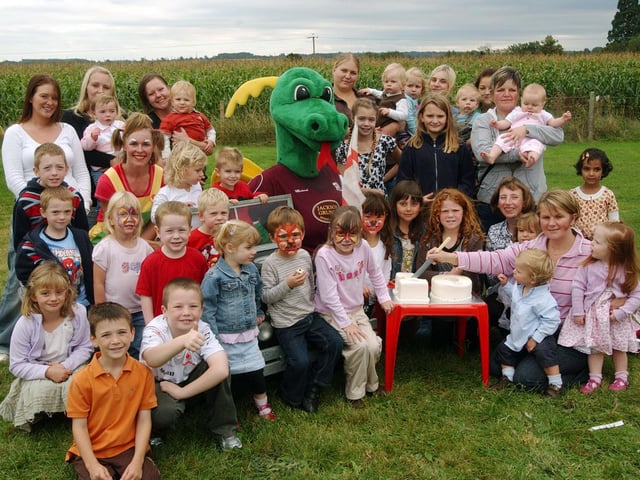 Rockinghorse Day Nursery, Greens Norton. Clarence the Dragon the Northampton Town mascot, Silly Soapey the Clown, staff and children past and present celebrate their 10th anniversary. Picture taken in 2007