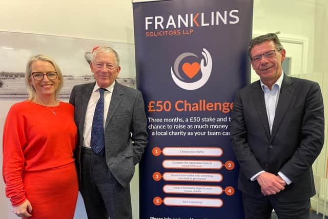 Andrea Smith, Partner and Simon Long, Managing Partner, pose with Nick Hewer, a keen supporter of the Franklins £50 Challenge.