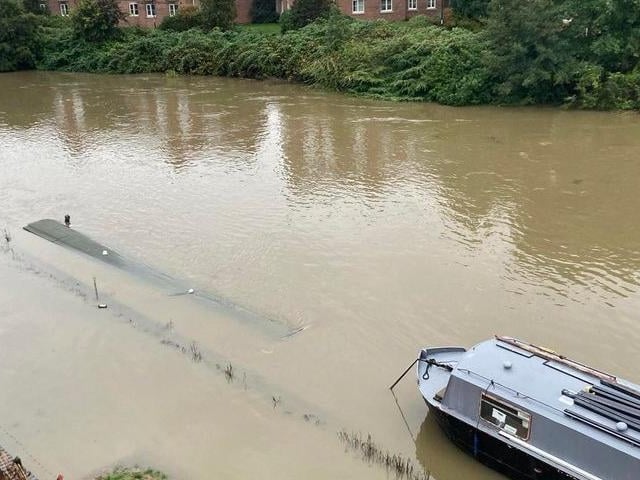 The sunken boat in the River Nene.