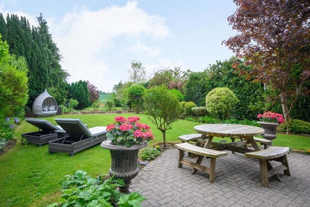 This Victorian home has a tennis court, huge gardens and a private mooring on the River Nene.