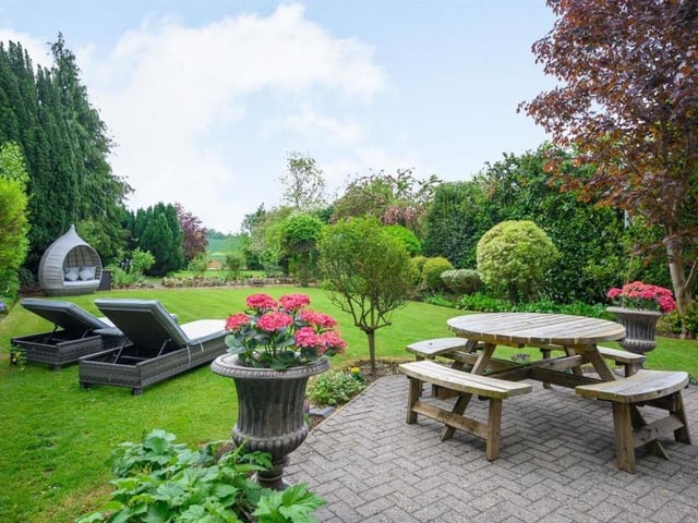 This Victorian home has a tennis court, huge gardens and a private mooring on the River Nene.