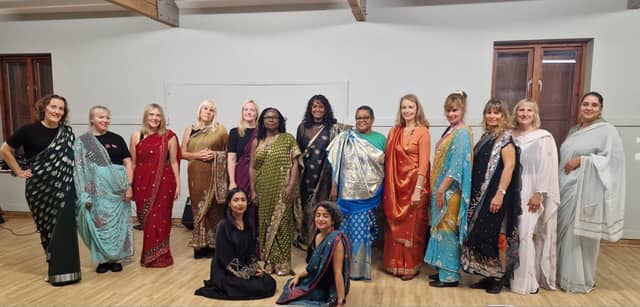 Poppy Jaman OBE (Front right) led the workshop teaching about the history and different ways to drape the saree
