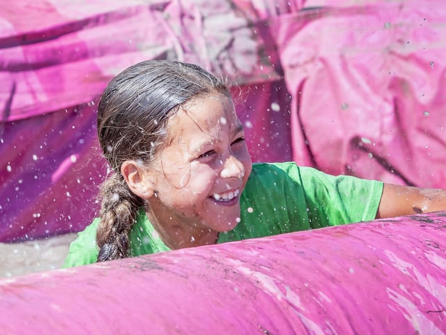 Children were all smiles on Saturday July 12 when they took part in the Race for Life, five kilometre obstacle course in Abington Park, Northampton.