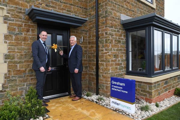 •	Gavin Jones, regional operations director for Miller Homes South Midlands, with Northampton Saints chairman John White opening the new show home