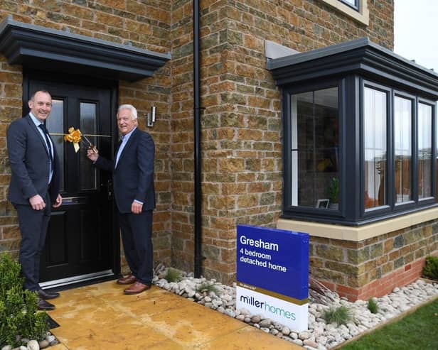 •	Gavin Jones, regional operations director for Miller Homes South Midlands, with Northampton Saints chairman John White opening the new show home