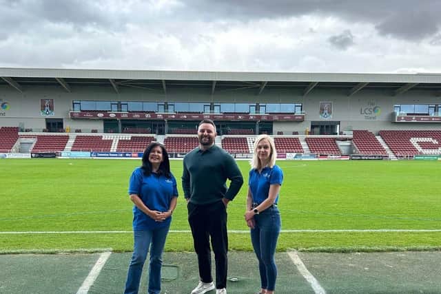 Cynthia Spencer Hospice’s Anita Frith and Nina Gandy with NTFC Commercial Director James Corrigan.