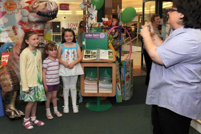 6 ft Inflatable Dinasour raises money for Save the Children in the Early learning centre Peacock Place back in 2011. In this photograph left to right Becca Leathersich (7) Beth Leathersich (5) Ellen Doyle (7) Sharon Birney (Store manager)
