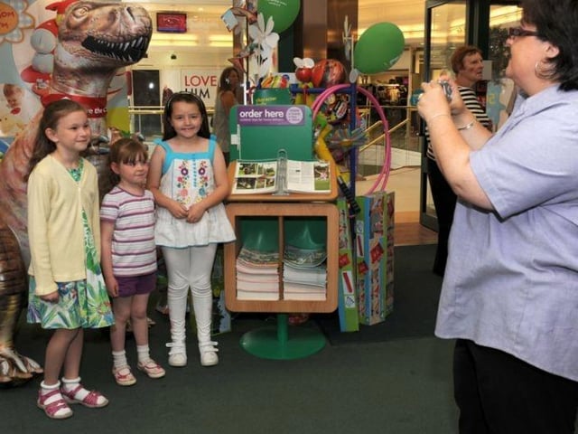 6 ft Inflatable Dinasour raises money for Save the Children in the Early learning centre Peacock Place back in 2011. In this photograph left to right Becca Leathersich (7) Beth Leathersich (5) Ellen Doyle (7) Sharon Birney (Store manager)
